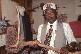 Osker Gilchrist and some of the healing paraphernalia in his treatment room (Image: William Arnett, 1997)